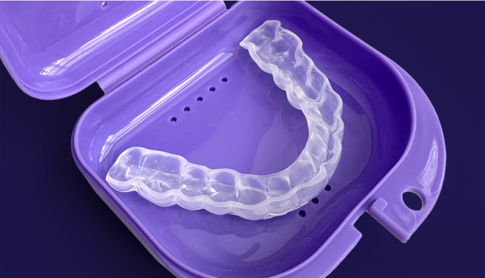 Zerene mouthguard in a purple case on a dark background