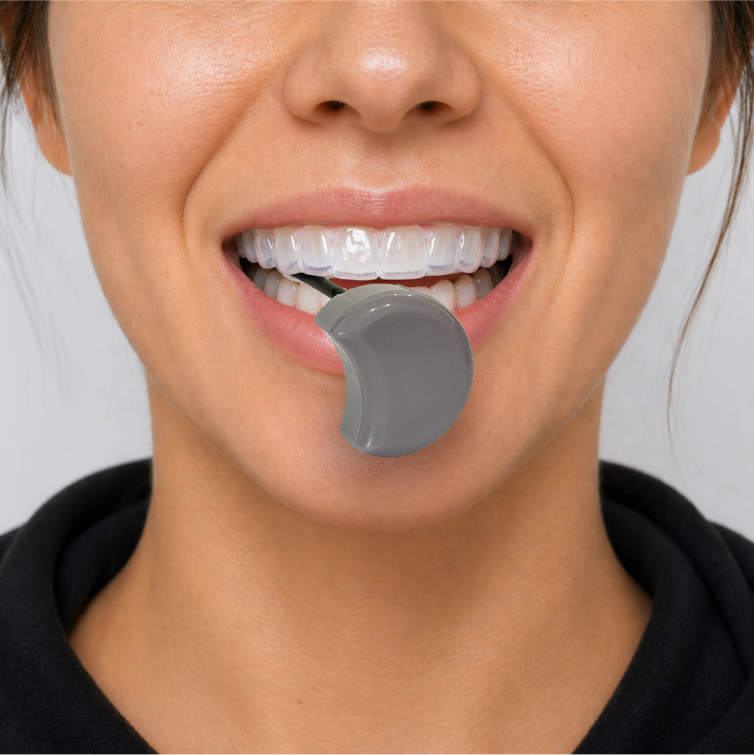 Person wearing a Zerene mouthguard with a Moon Module against a neutral background