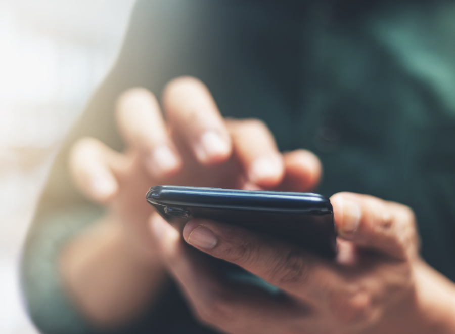 Close up of hands using a smartphone