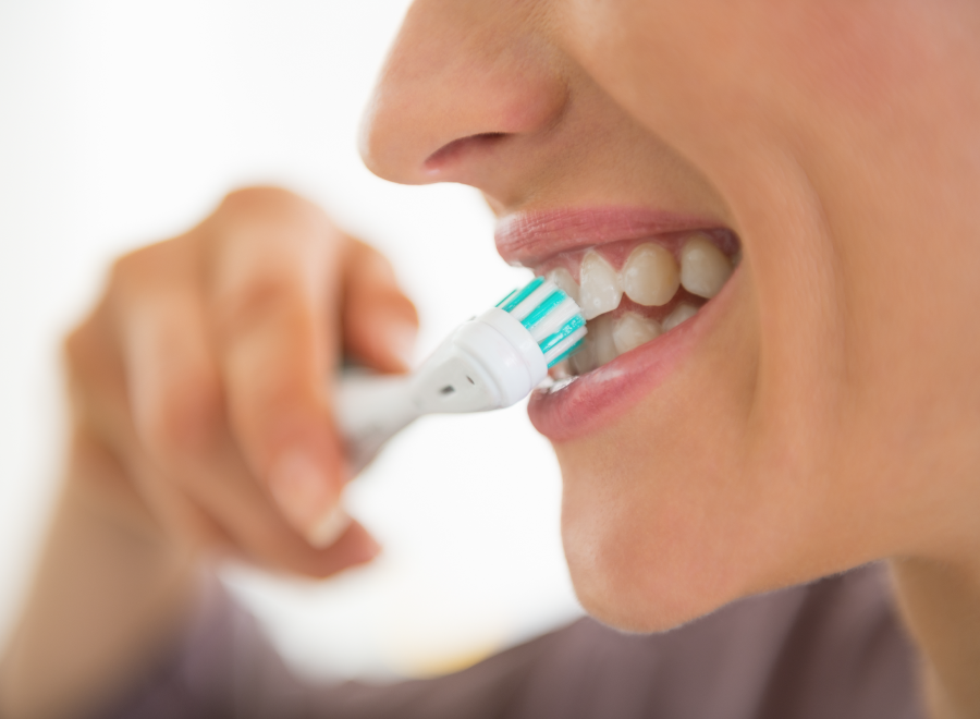 Close up of a person brushing her teeth