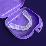 Zerene mouthguard in a purple case on a dark background