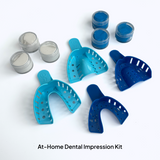 Small and large dental impression trays on a white background