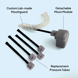 Custom lab-made Zerene mouthguard with detachable Moon Module and replacement pressure tubes on a light blue background.